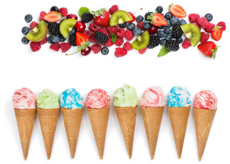  Flat lay concept of different ice cream cones and berries.