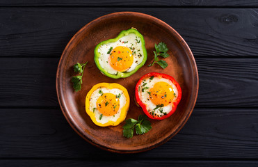 Yellow , red and green pepper with fried eggs