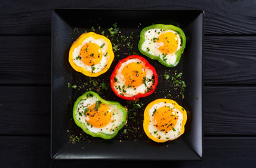 Yellow , red and green pepper with fried eggs
