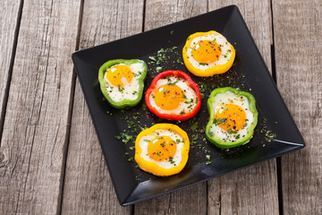 Yellow , red and green pepper with fried eggs