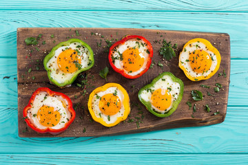 Yellow , red and green pepper with fried eggs