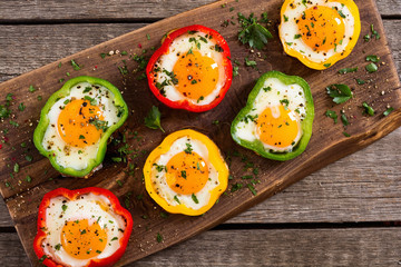 Yellow , red and green pepper with fried eggs