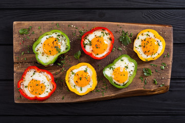 Yellow , red and green pepper with fried eggs