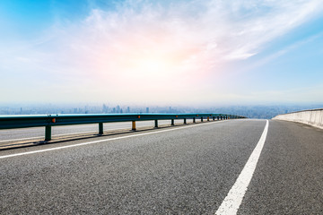 Empty highway road and modern city skyline in Shanghai,China