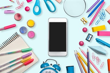 Colorful school supplies on white background