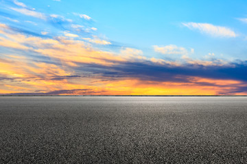 Asphalt road and sunset sky