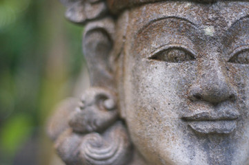 Fototapeta na wymiar Close up of a beautiful Balinese stone statue