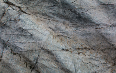 The texture of the stone. Light background. Relief surface
