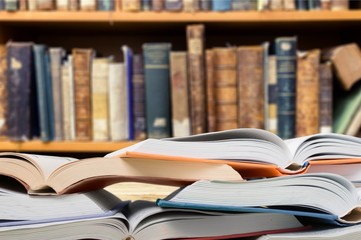 Stack books collection on library background