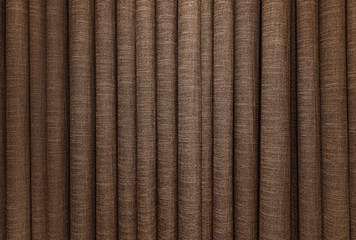 Corrugated pattern and textured of the brown fabric curtains or the drape inside the room with interior decoration
