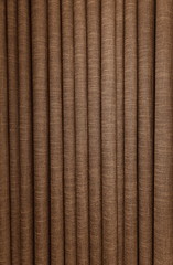 Corrugated pattern and textured of the brown fabric curtains or the drape inside the room with interior decoration