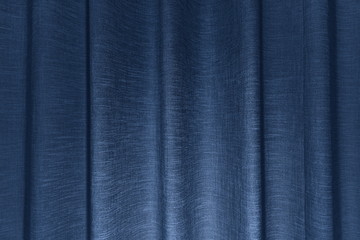Corrugated pattern and textured of the blue fabric curtains or the drape inside the room with the interior decoration