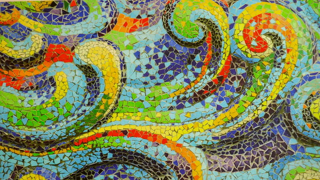 Detail of a colorful mosaic with abstract wave pattern. Close-up.