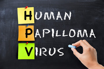 Human papilloma virus written with adhesive notes on blackboard, women’s health concept