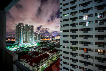 Naklejka premium Blurred background of city views (high buildings, condominiums) and night lights of road traffic