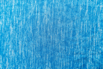 A uniformly lit blue fabric texture with soft shadows.