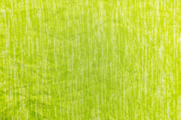 A uniformly lit yellow fabric texture with soft shadows.