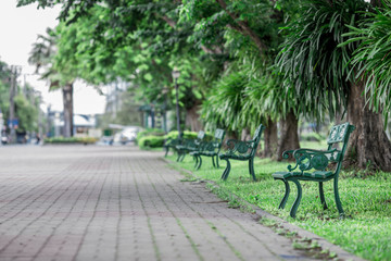 The blurred background of modern design chairs placed for tourists to sit in the park or while traveling