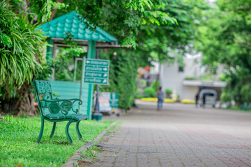 The blurred background of modern design chairs placed for tourists to sit in the park or while traveling