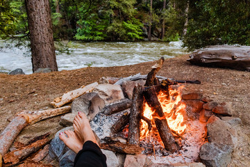 Camp fire by the river