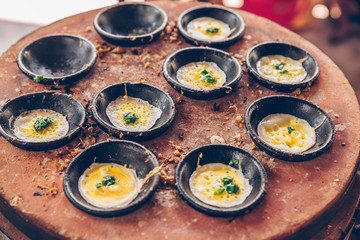 Vietnamese mini fried eggs, cooking on the street - Traditional Vietnamese food