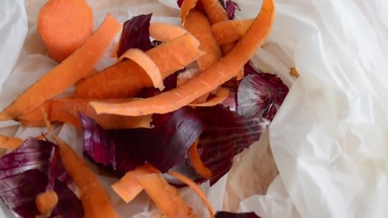 timelapse stop motion, white biodegradable bag being filed buy organic waste
