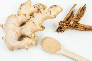Ginger root and cinnamon ; photo on neutral background