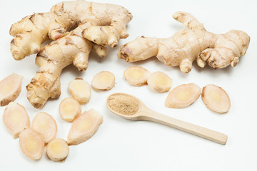 Fresh roots and ginger powder - Zingiber officinale; photo on neutral background