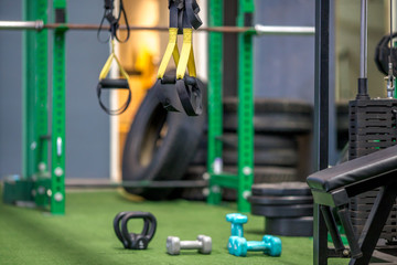 The background of the exercise equipment set for good health (steel balls, dumbbells, cable, weightlifting, boxing boxing gloves, fitness balls) has a blurred light that Fall 