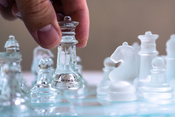 Chess board game made of glass, business competitive concept