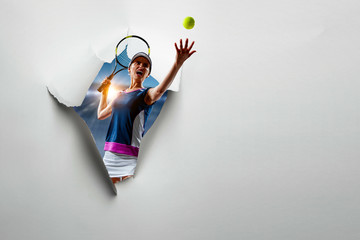 Fototapeta premium Paper torn hole effect with female tennis player. Mixed media