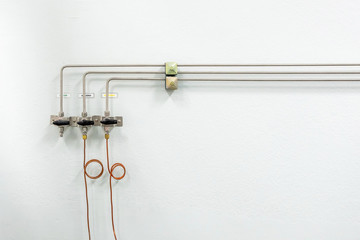 Valves of nitrogen, Helium, Oxygen ( Air Zero) pipes and Gas Pressure Meter with Regulator for monitoring measure pressure production process in Chemistry Laboratory room