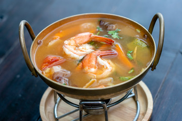 Tom yam kung or Tom yum, Tom yam is a spicy clear soup typical in Thailand. Popular food in Thailand