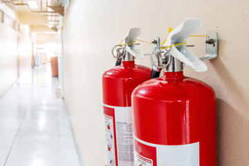 Fire extinguisher system on the wall background, powerful emergency equipment for industrial