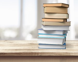 Collection of old books stack on blurred  background