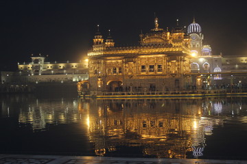 stunning night view of golden temple, reflection of light