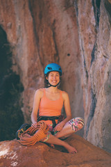 Climber in a helmet on the background of beautiful mountains.