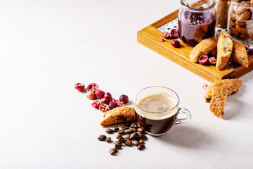 Cup of espresso coffee with cranberry cantucci