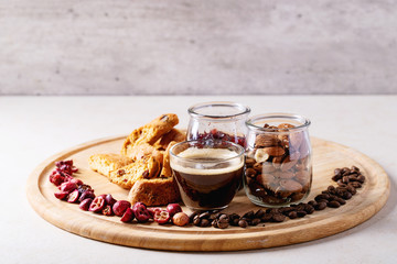 Cup of espresso coffee with cranberry cantucci