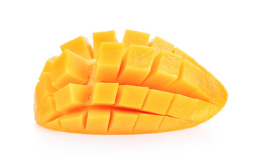 Ripe yellow Mangoes cut half in cubes isolated on white background.