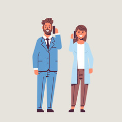 businesspeople couple using smartphones business man woman making calls talking on cellphone communication concept colleagues standing together flat full length