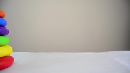 educational toy close up pan rightdiferent sized rings on the stand