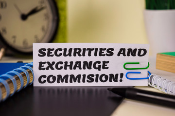 Securities and Exchange Commision! on the paper isolated on it desk. Business and inspiration concept