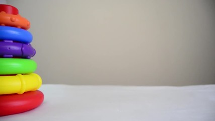 educational toy close up pan left revealing shot diferent sized rings on the stand