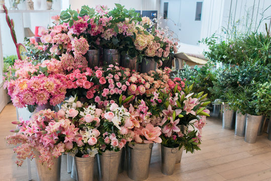 Many flowers and bouquets stand in a florists shop