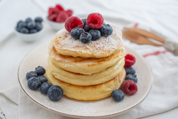 home made sweet pancakes with berries for breakfast