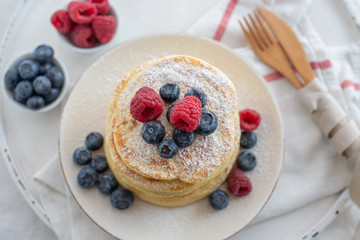 home made sweet pancakes with berries for breakfast