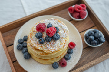 home made sweet pancakes with berries for breakfast