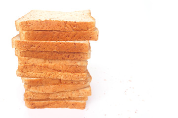 Close up brown sliced whole wheat bread isolated on white background.Healthy homemade sandwich breakfast preparing.Cooking bio ingredients.Food background concept with copy space.Top view.