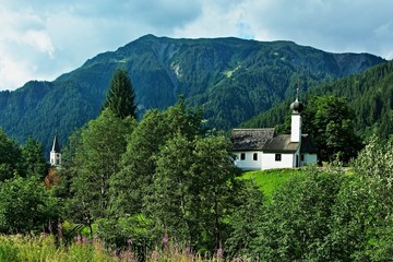 Austrian Alps-view of the church tower and chapel in town Gaschurn